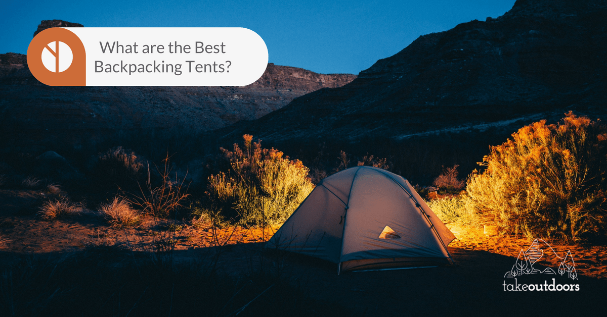 Picture of a tent infront of mountains at night