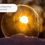Image of a perfect sphere clear ice with sunlight behind